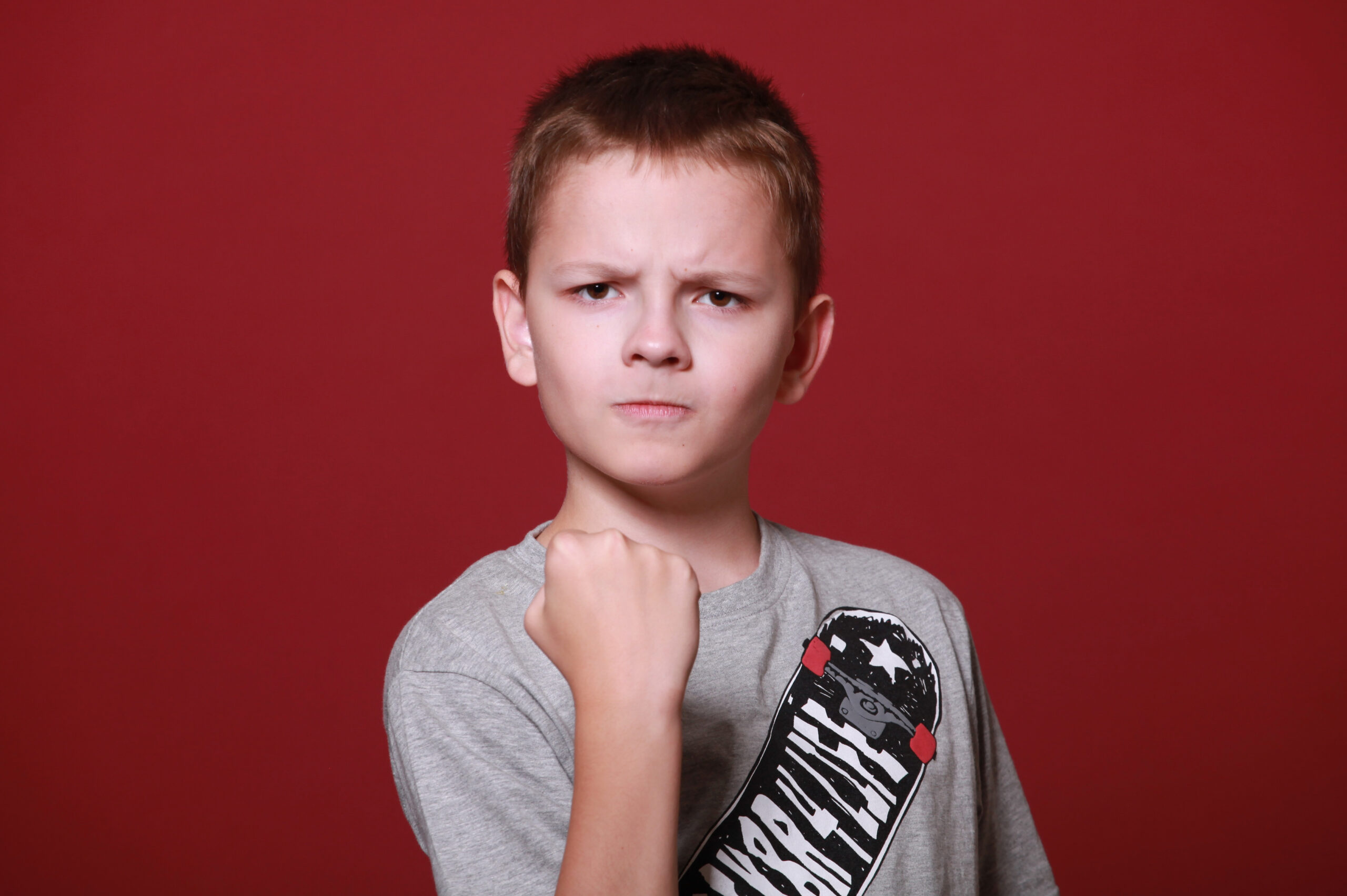 an angry school-aged boy