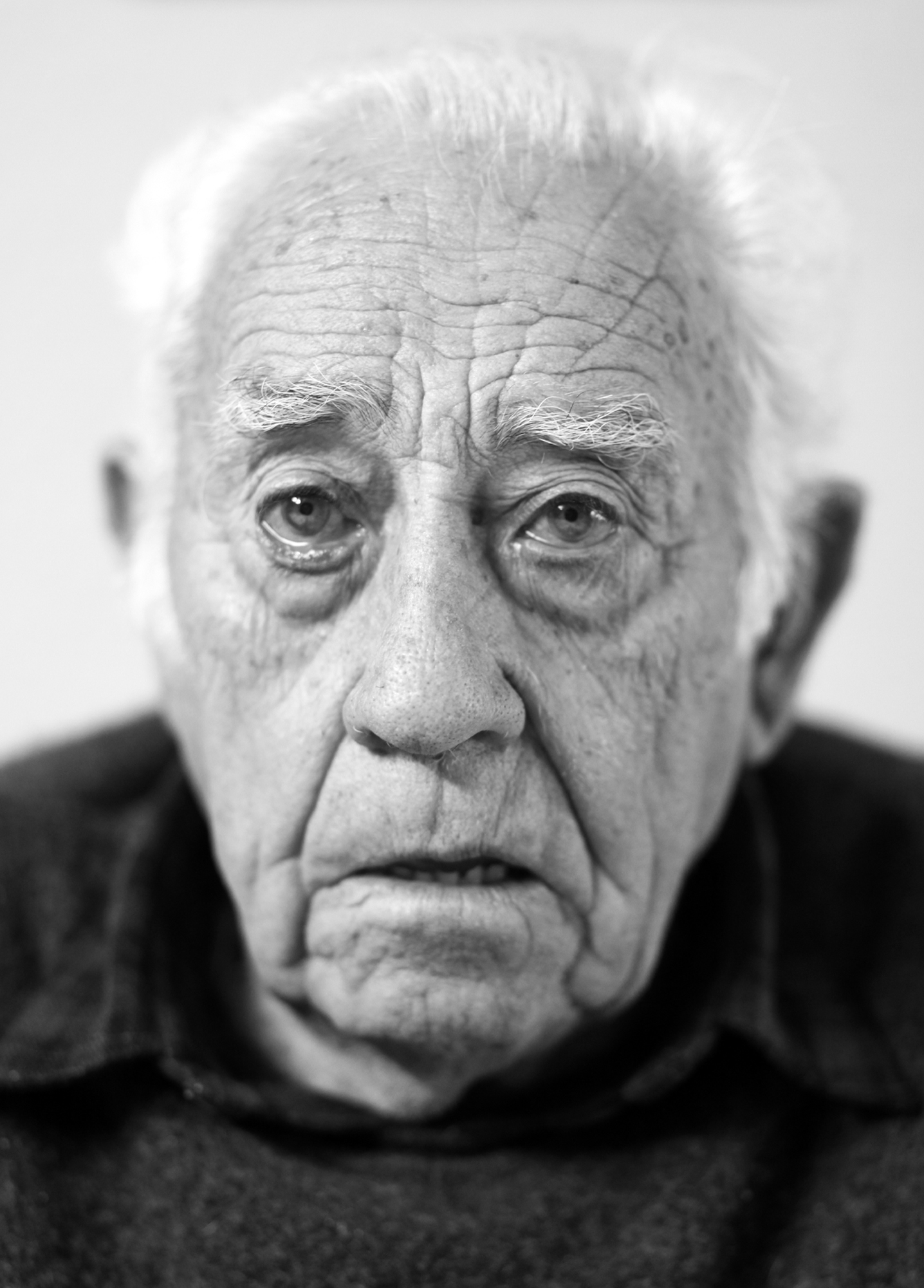 a sad elderly man