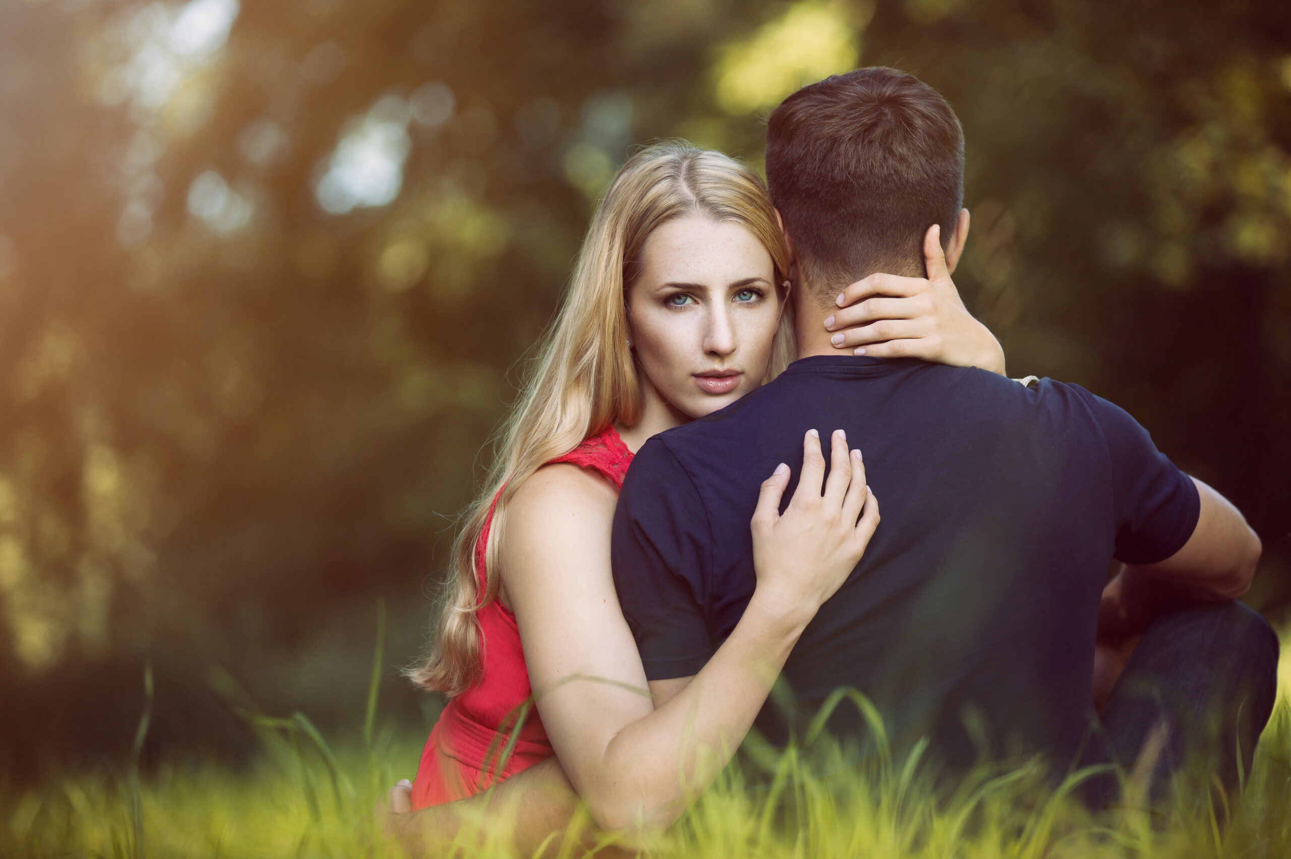 a woman sitting with a man